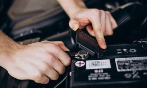 Repair man making car service Repair man making car service